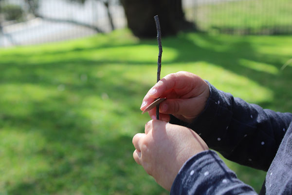child playing with a stick